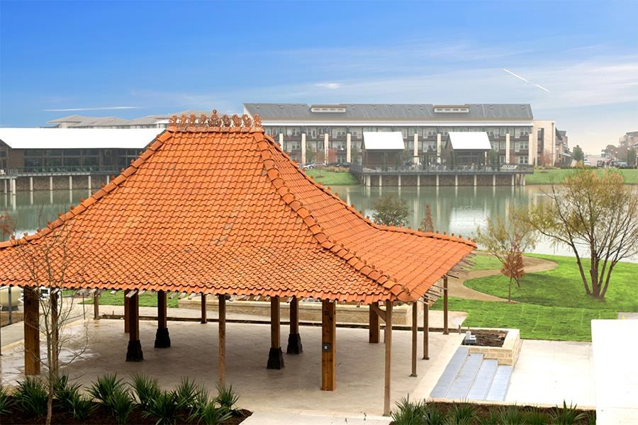 a pavilion with a building in the background