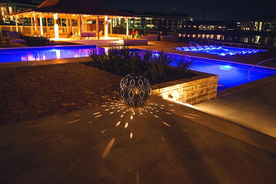 a pool is lit up at night