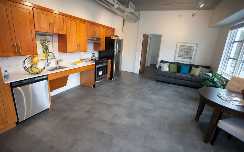 a view of a kitchen and living room of a apartment