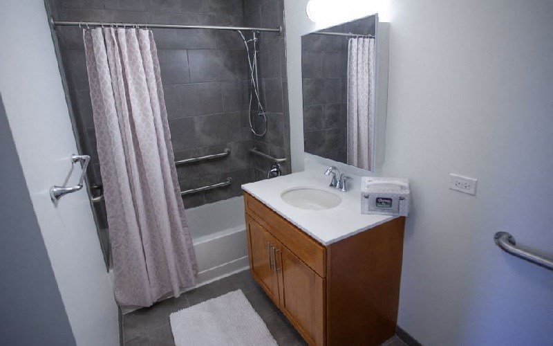 a bathroom with a sink and a shower