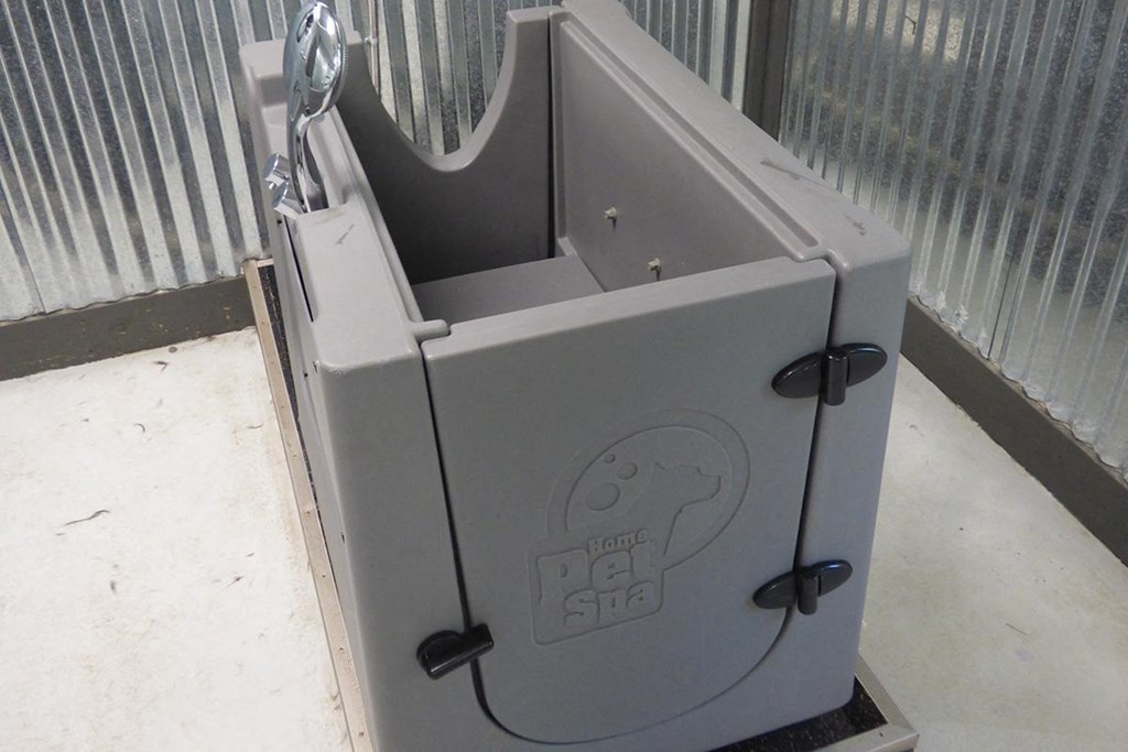 a grey post box with a sticker on it