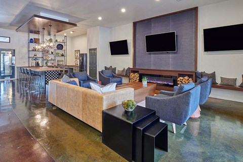 A modern living room with a long sofa and a television.
