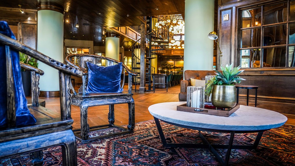 a living room with a chair and a table