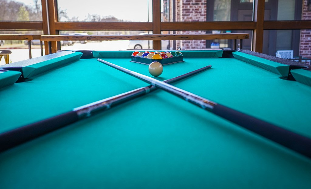 a pool table in a room with a ball on it
