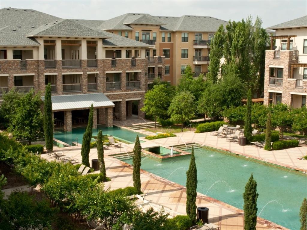a view of the pool at the apartments