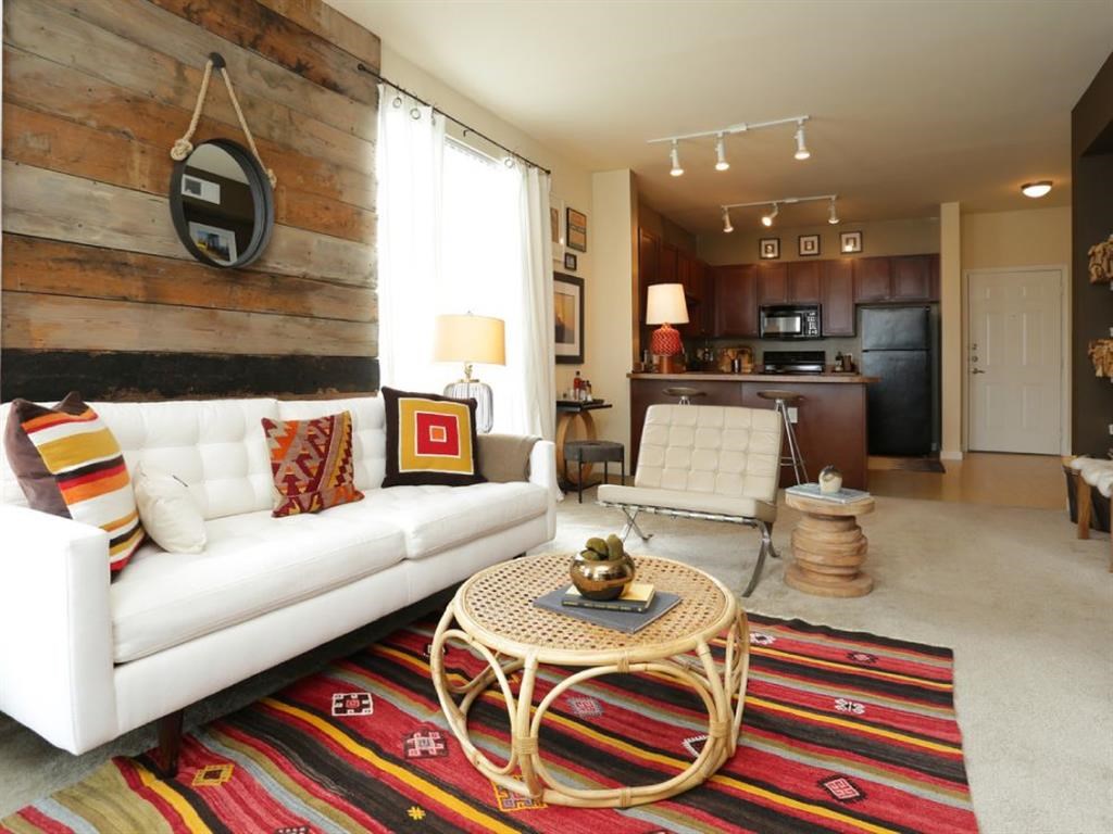 a living room with a white couch and a table
