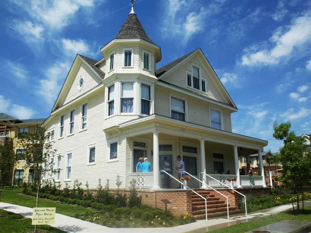 a white house with a steeple on top of it