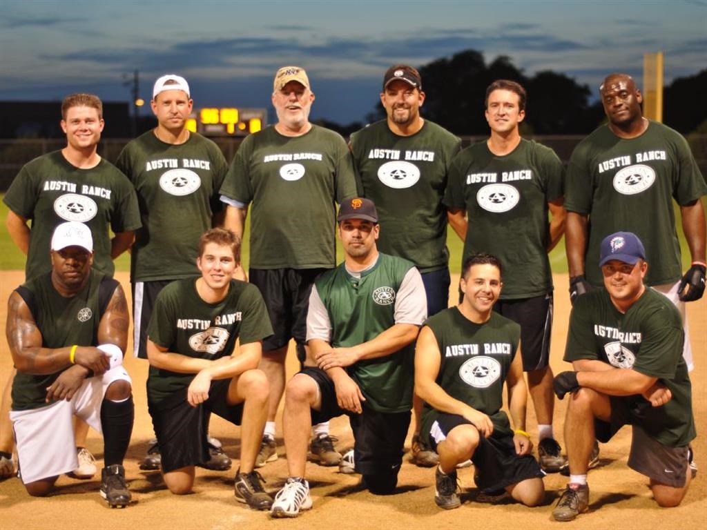 a group of baseball players posing for a team photo