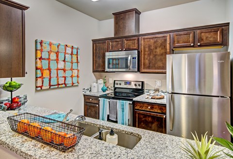 Stainless Steel Appliances & Granite Countertops at The Arbors at Edgewood Apartments, Edgewood, 98372