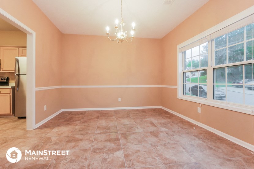 the dining room of this home is empty and ready to be remodeled