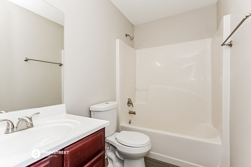 a bathroom with a sink toilet and a shower