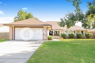 a house with a garage and a lawn