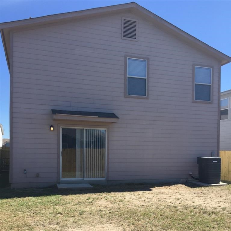 a white house with a window and a door