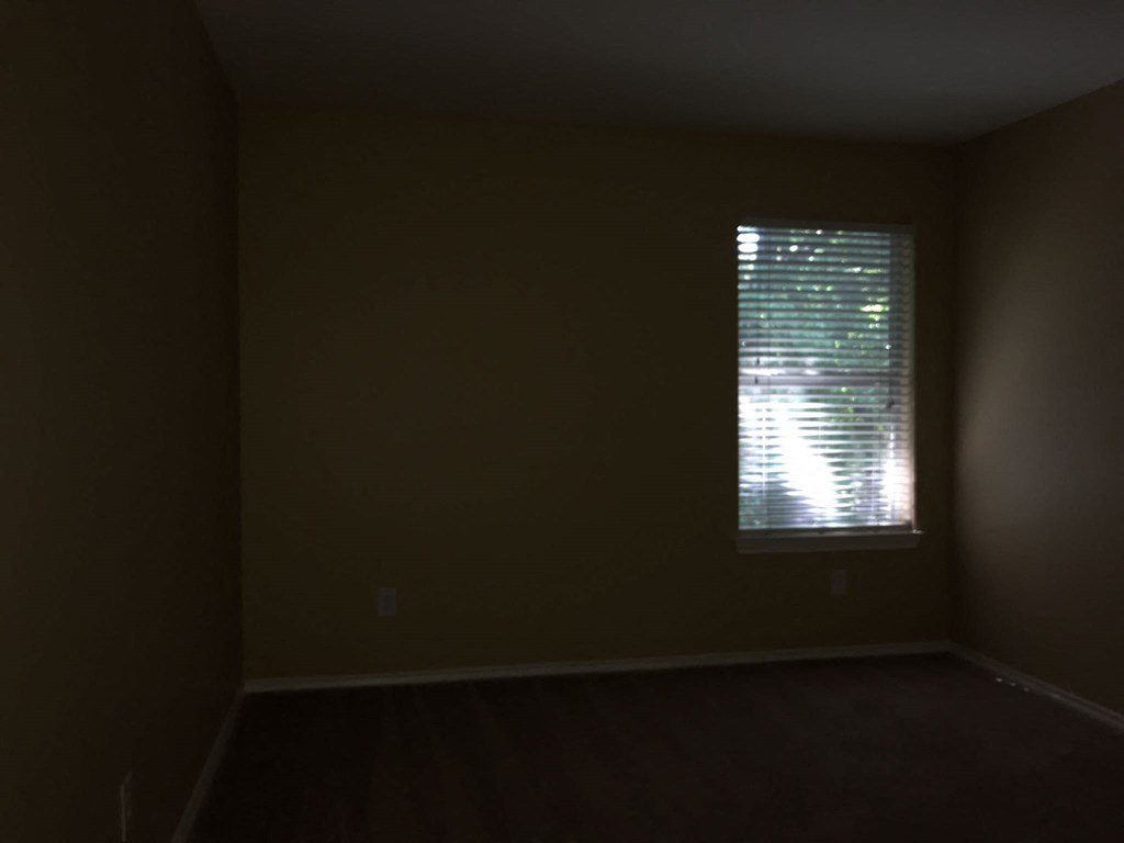 an empty room with a window in it