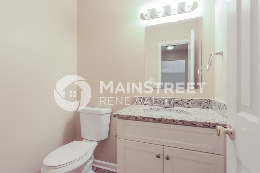 a renovated bathroom with a sink and a toilet