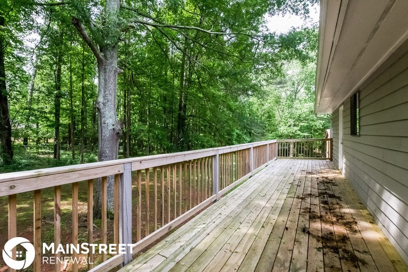 the view from the deck of a cabin in the woods