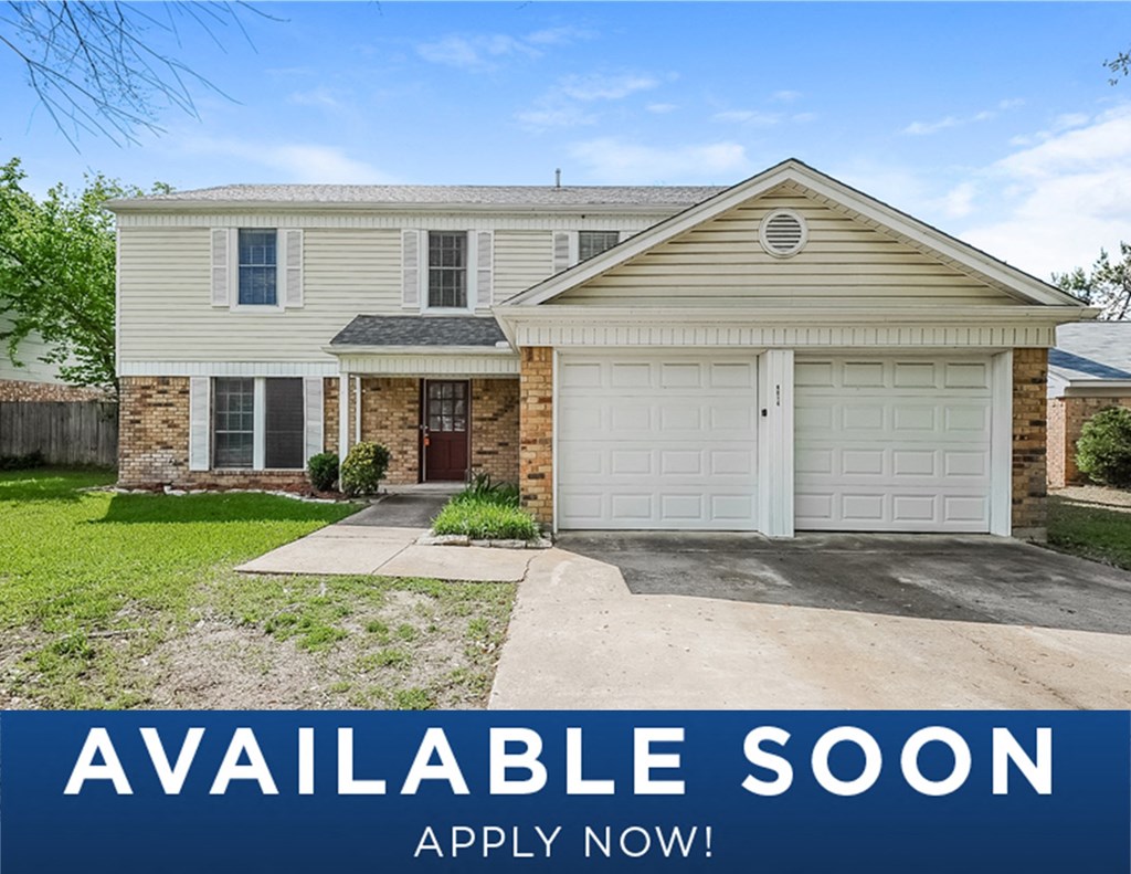 a white house with a white garage door