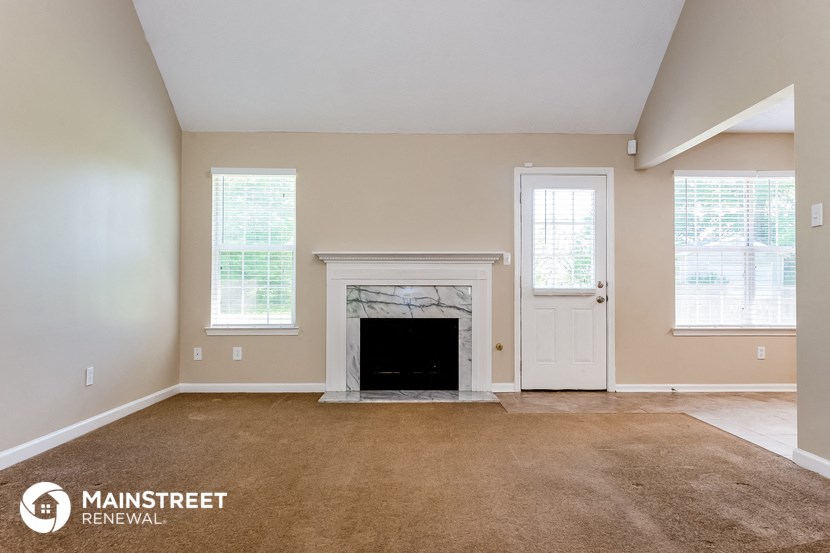the living room of a home with a fireplace