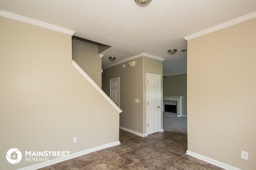 the living room and dining room are empty and ready to be remodeled