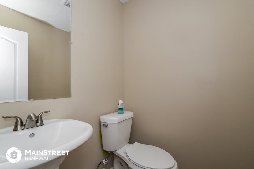 a bathroom with a toilet and a sink