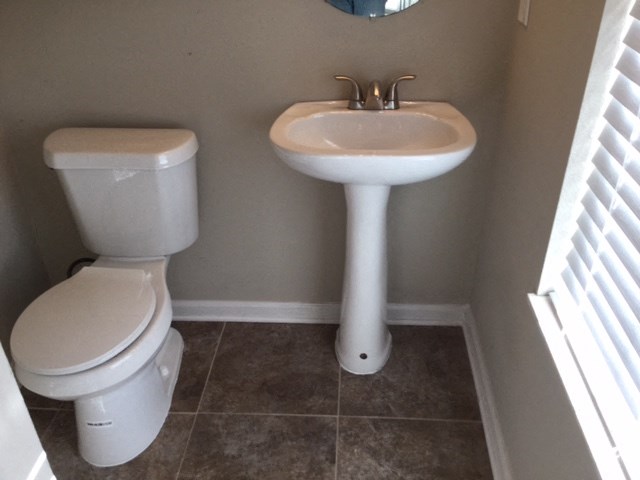 a bathroom with a sink and a toilet