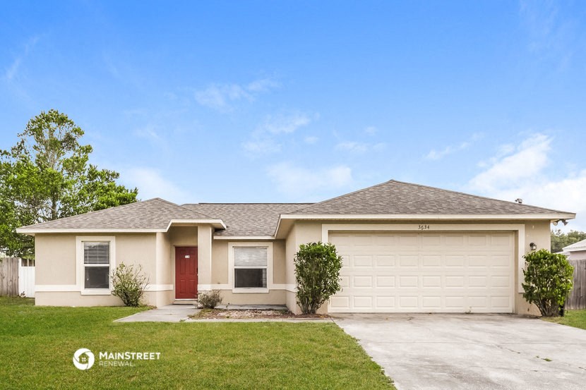 a house with a driveway and a garage door
