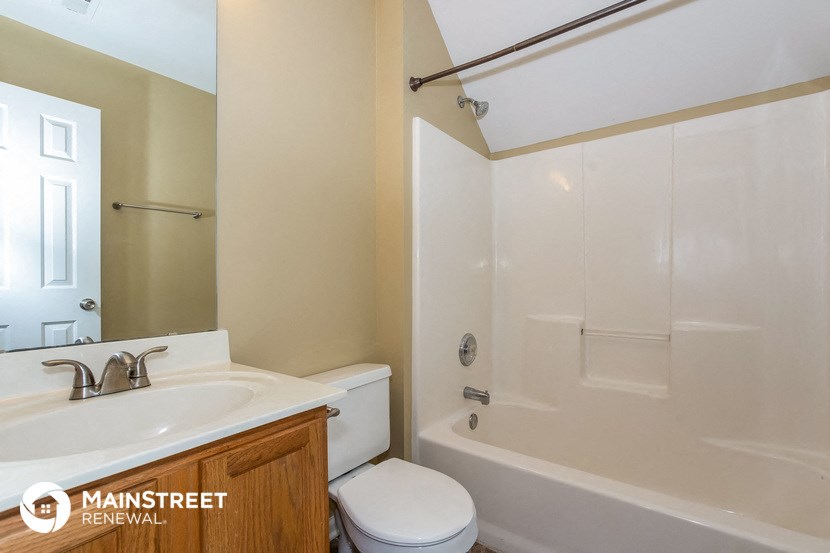 a bathroom with a sink toilet and a shower