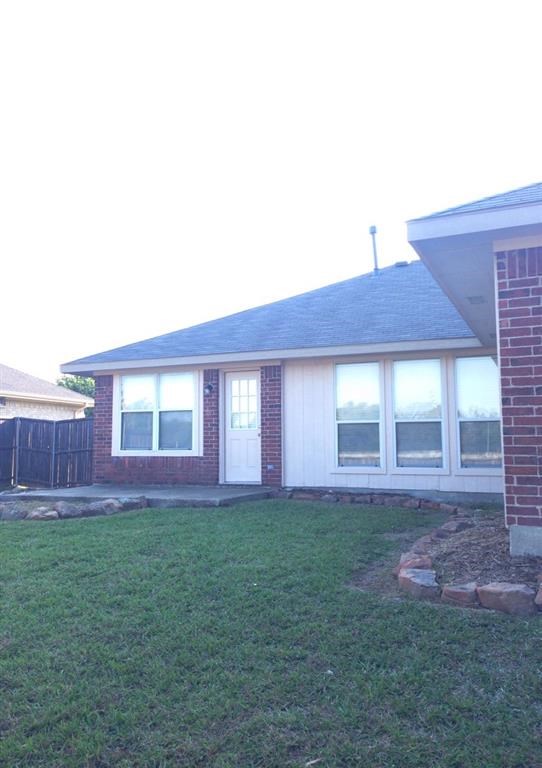 a house with a lawn in front of it