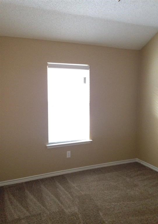 an empty room with a window in it