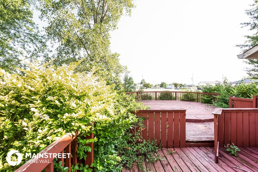 a deck with a view of a body of water