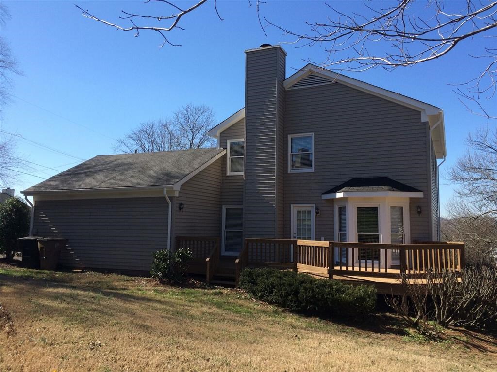 a house with a porch and a deck