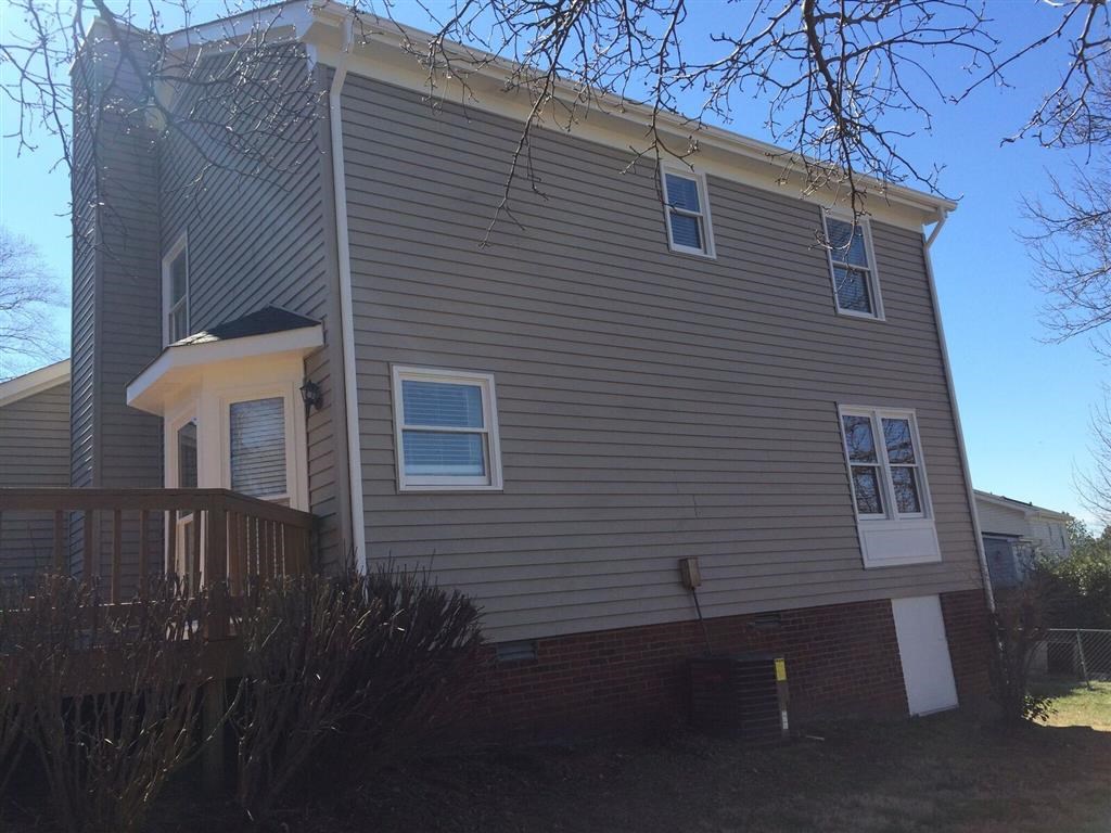 a house with a deck on the side of it