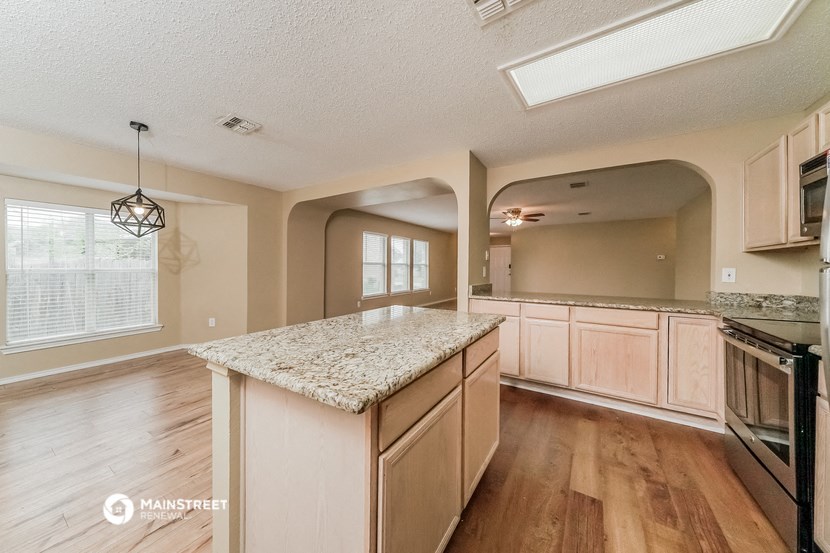 the kitchen is spacious and has a large island