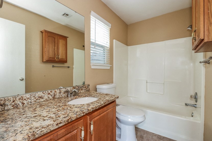 a bathroom with a sink toilet and a shower
