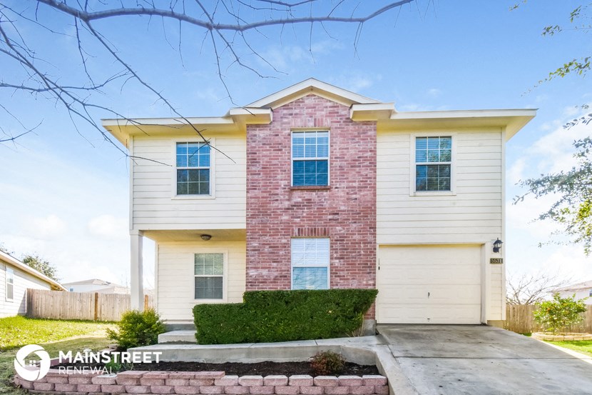 a brick and with a sidewalk in front of it