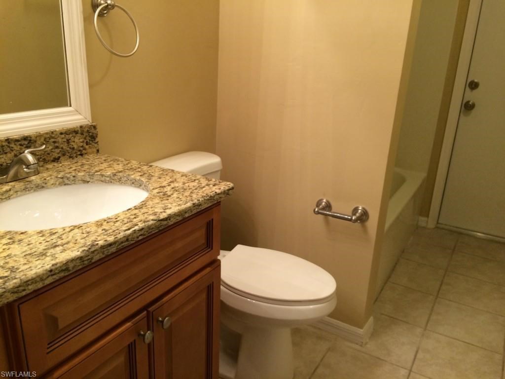 a bathroom with a toilet and a sink