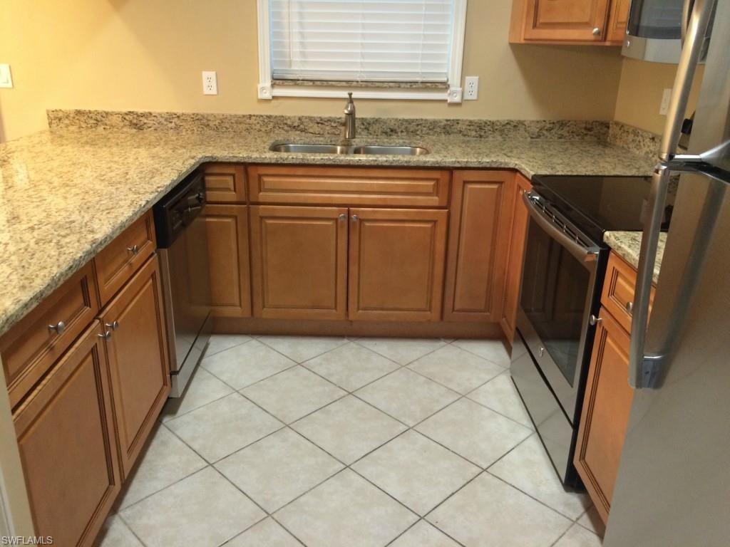 a kitchen with a sink and a counter top