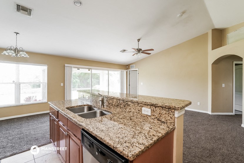 a kitchen with granite counter tops and a sink