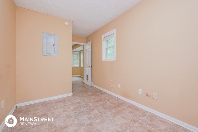 the living room and dining room of a house