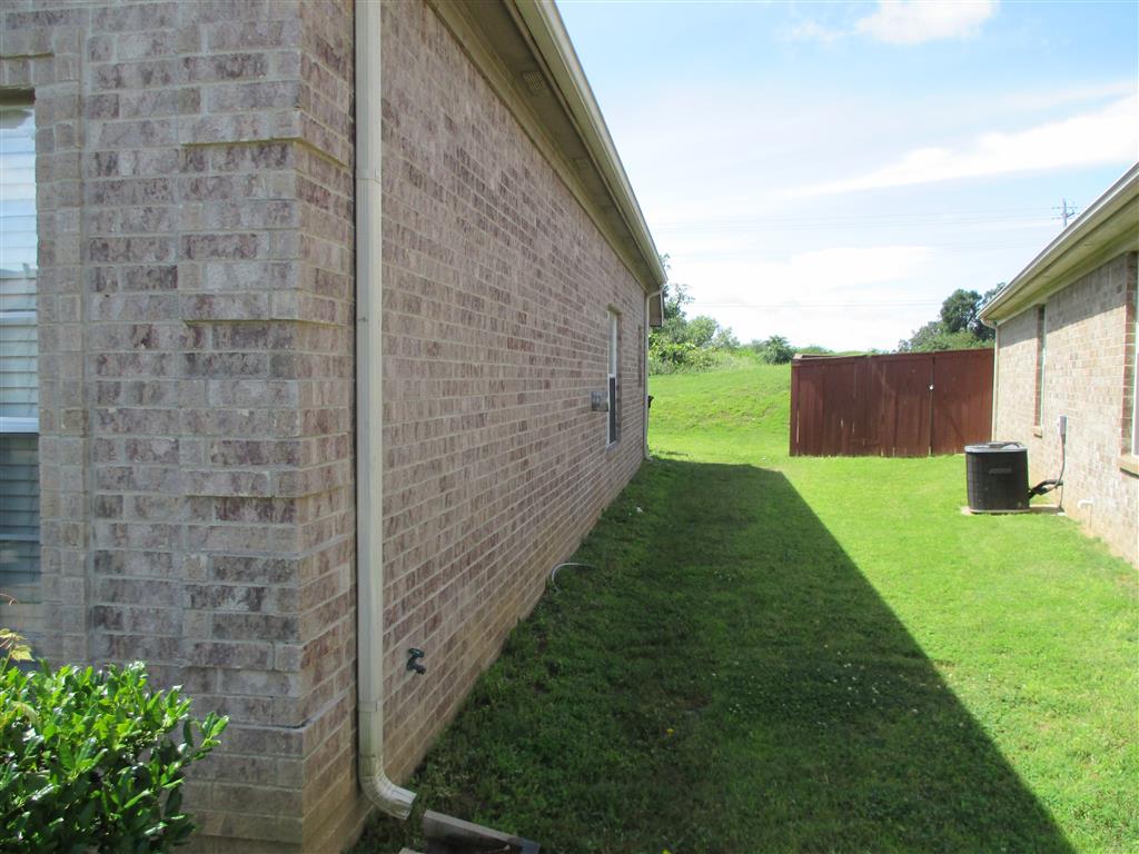 a side view of the side of a brick building