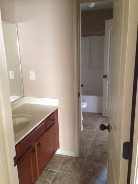 a bathroom with a sink and a toilet in it