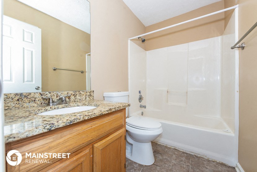 a bathroom with a sink toilet and a shower