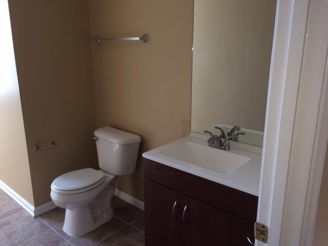 a bathroom with a toilet and a sink