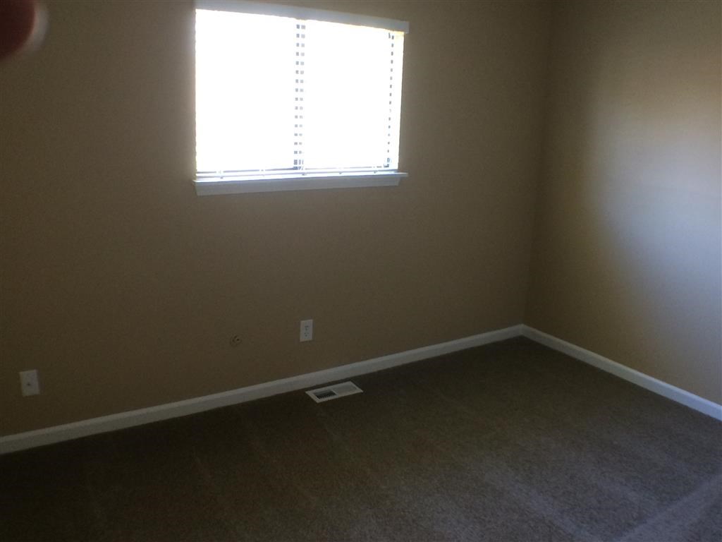 an empty room with a window in it