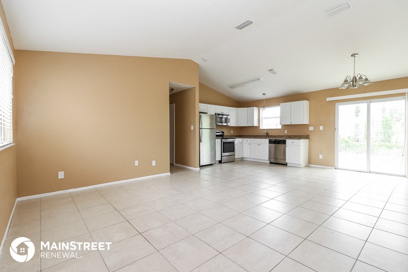 the spacious living room and kitchen of this 2500 sq ft home