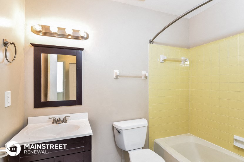 a bathroom with a sink toilet and shower and a bath tub