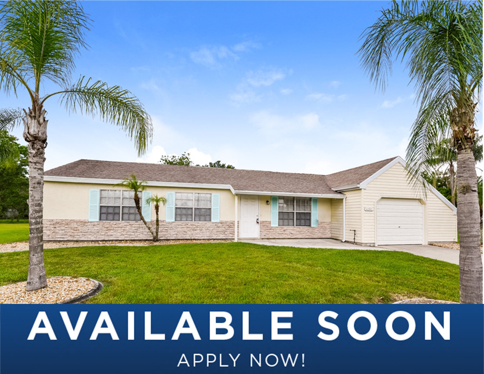 a white house with palm trees in front of it