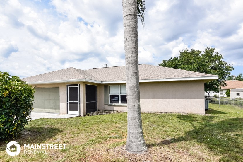 a house with a palm tree in front of it