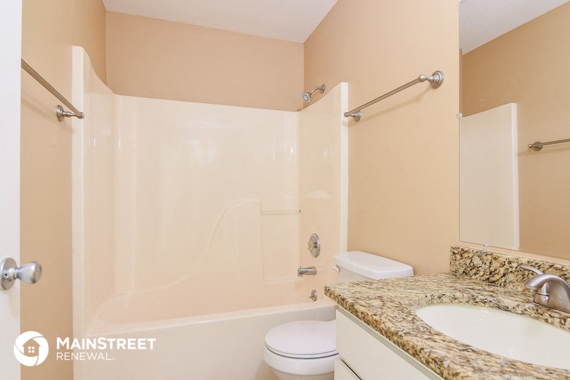 a bathroom with a sink toilet and a shower