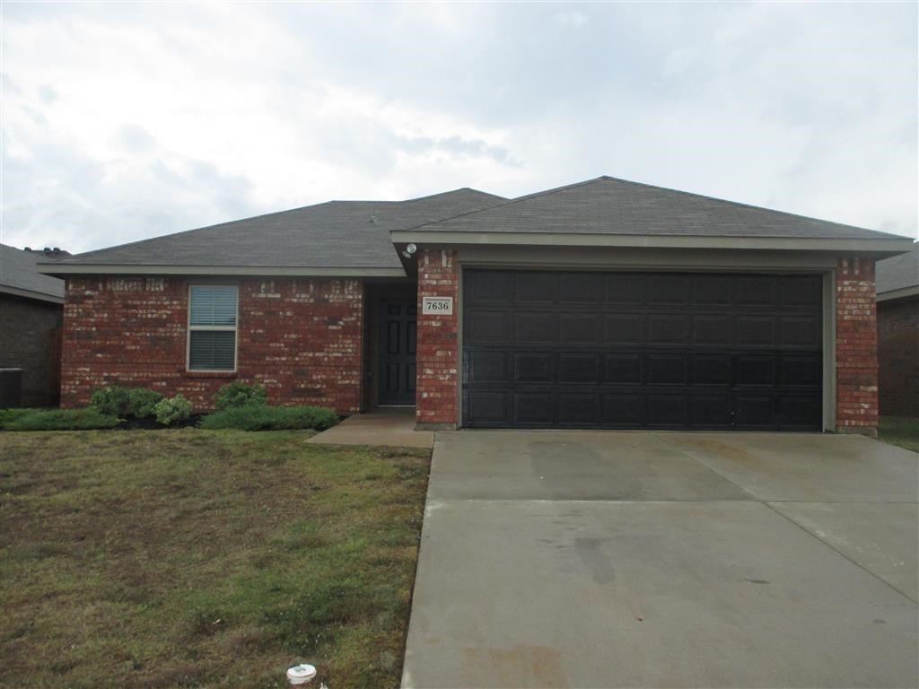 a house with a driveway and a garage door